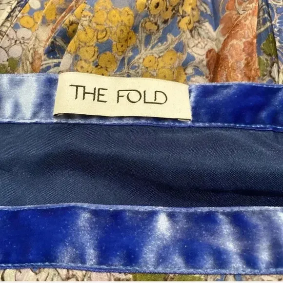 The Fold pleated blue colorful midi skirt. Size UK 10 which is about a 6 in US.